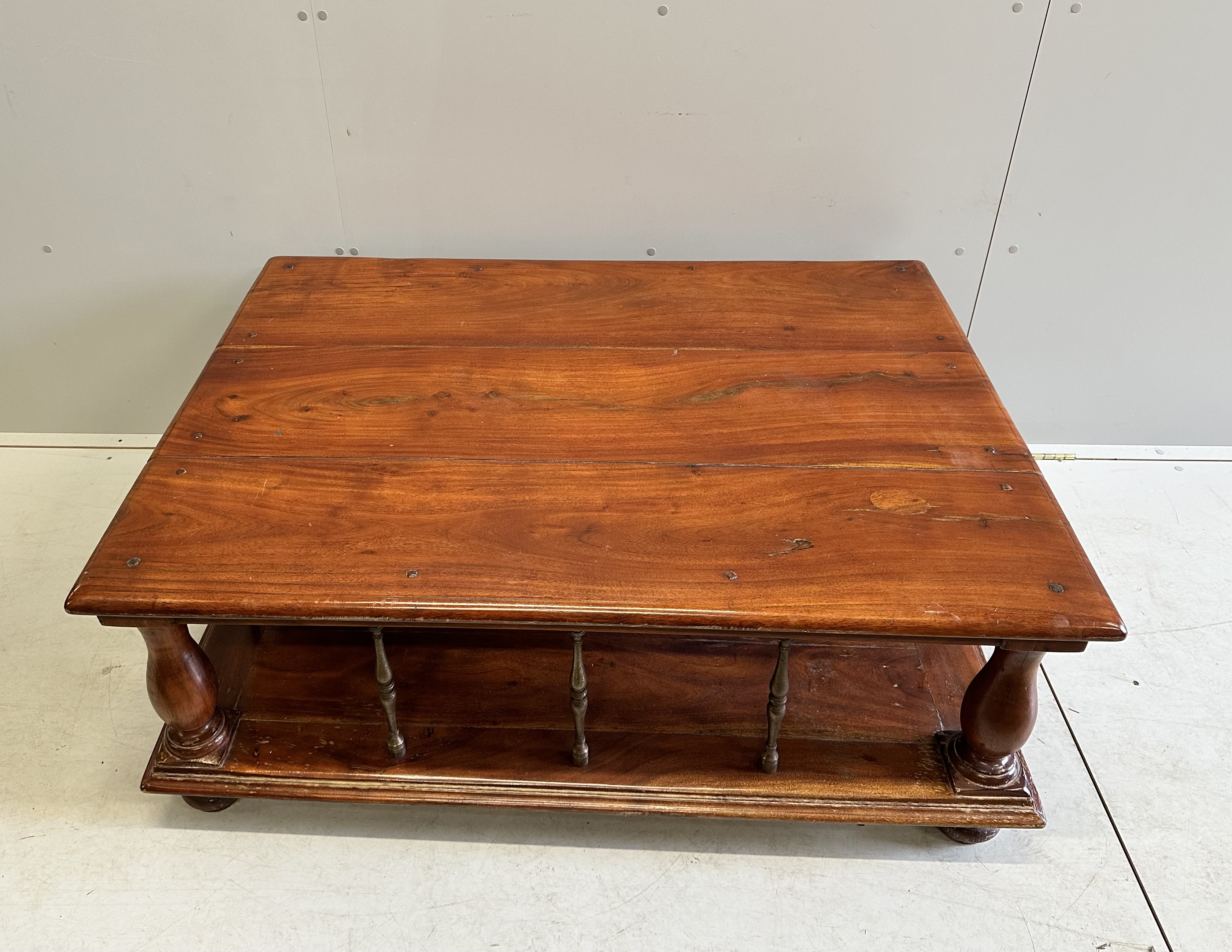A rectangular brass mounted mahogany two tier coffee table, width 122cm, depth 91cm, height 48cm
